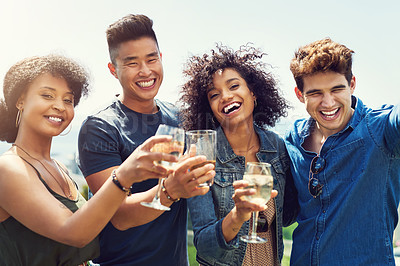 Buy stock photo Portrait of a group of friends having drinks and sharing a toast together outside while on holiday