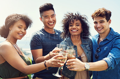 Buy stock photo Portrait of a group of friends having drinks and sharing a toast together outside while on holiday