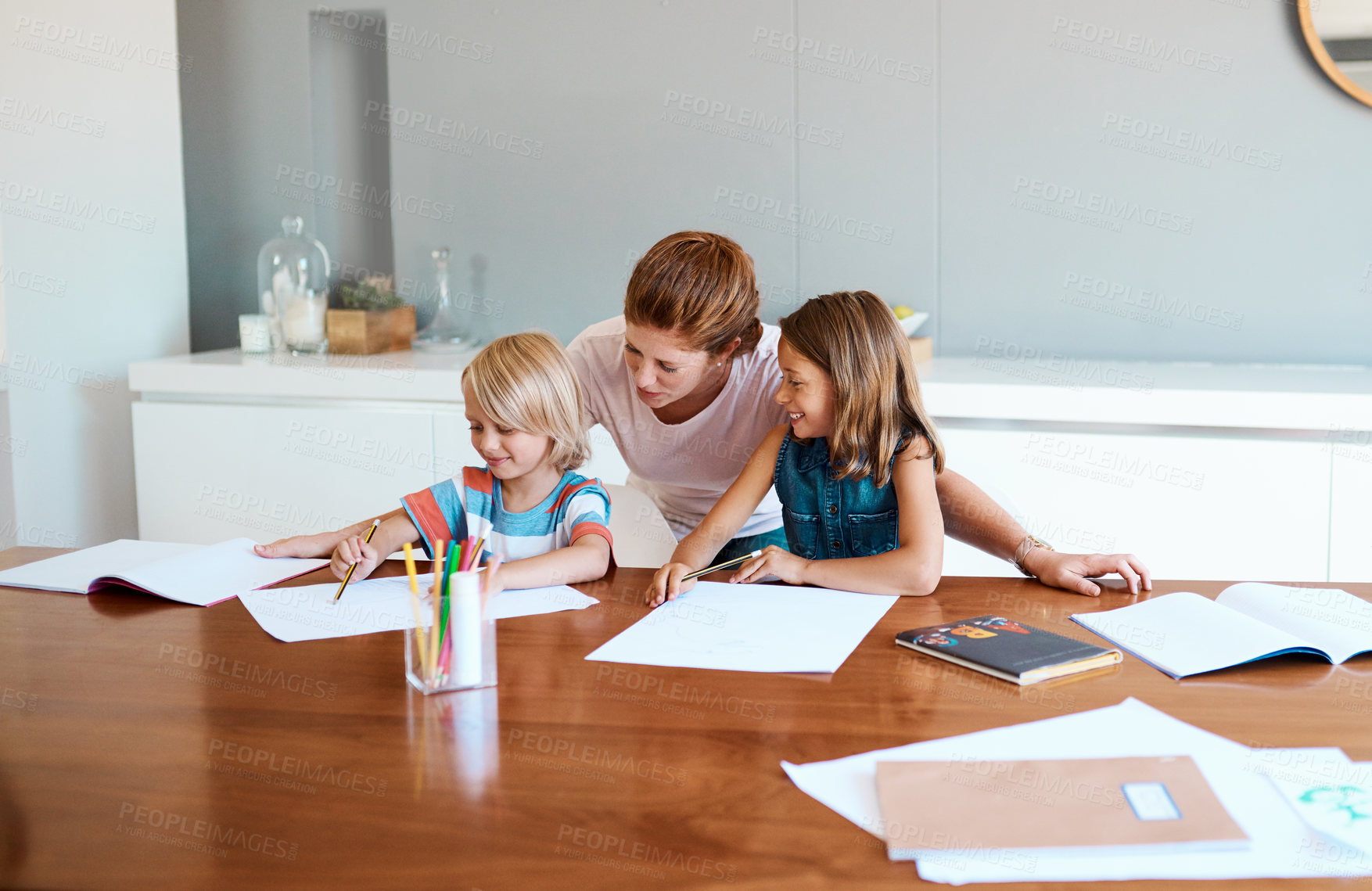 Buy stock photo Mom, children and paper in home for education, distance learning and creativity for growth. House wife, kids and happy at table for knowledge, fun activity and writing skill development in lesson