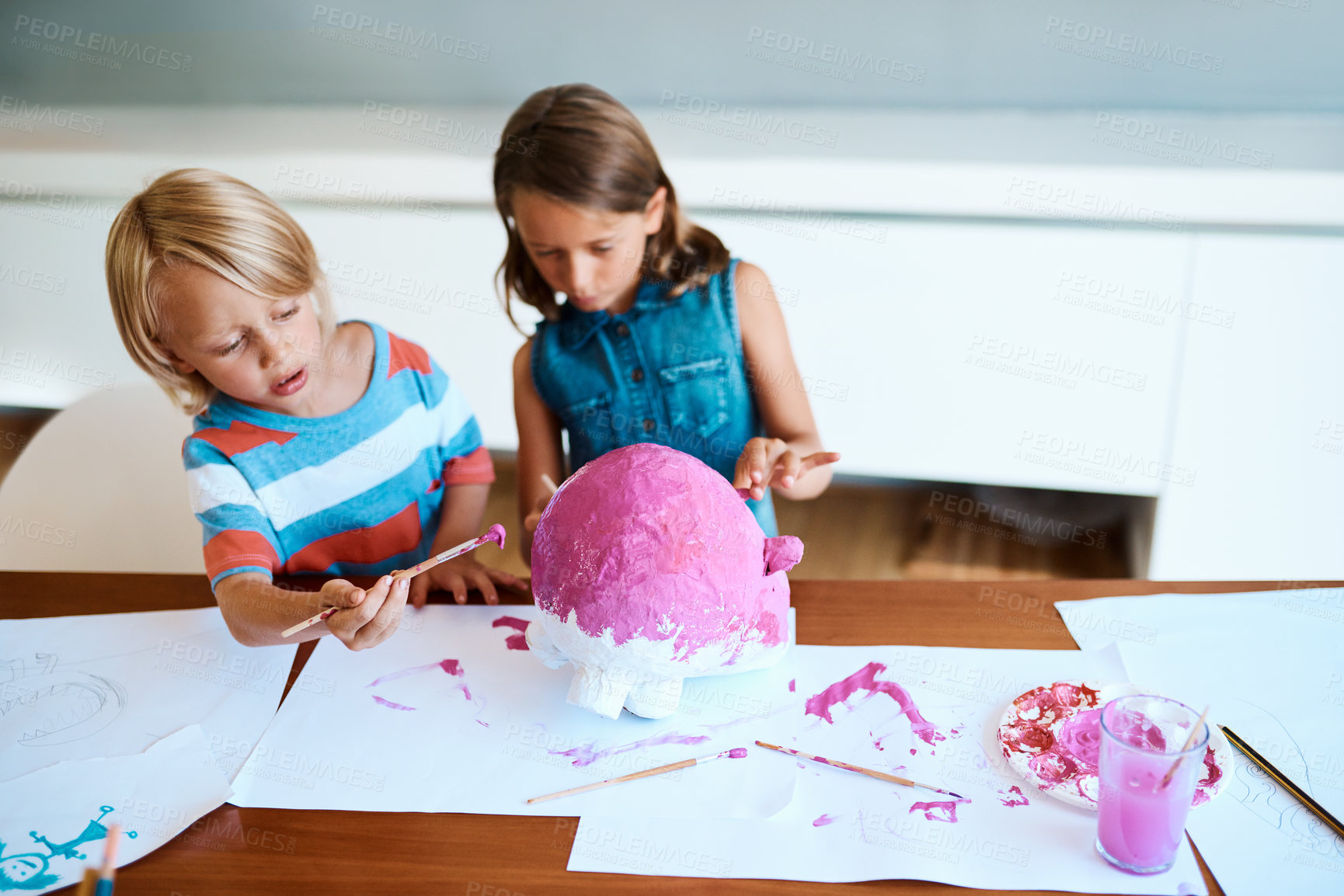 Buy stock photo Painting, children and project in home for creativity, fun activity and design for arts and crafts. Messy, kids and creative on table for paper mache, DIY piggy bank and relationship development