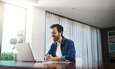 Buy stock photo Business man, video call and laptop in home office for listening, audio and communication at desk. Young businessman, computer and earphones for webinar, online consultation or remote work with smile