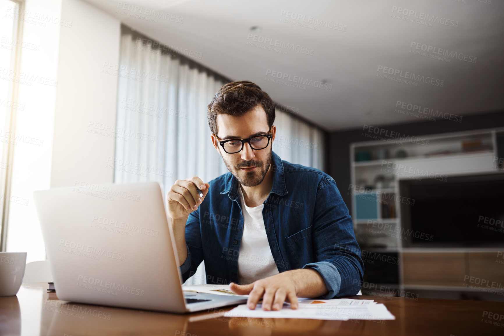 Buy stock photo Business man, laptop and documents for hybrid work, research and financial planning in home office. Project management, technology and paperwork in house for budget proposal, progress report and kpi