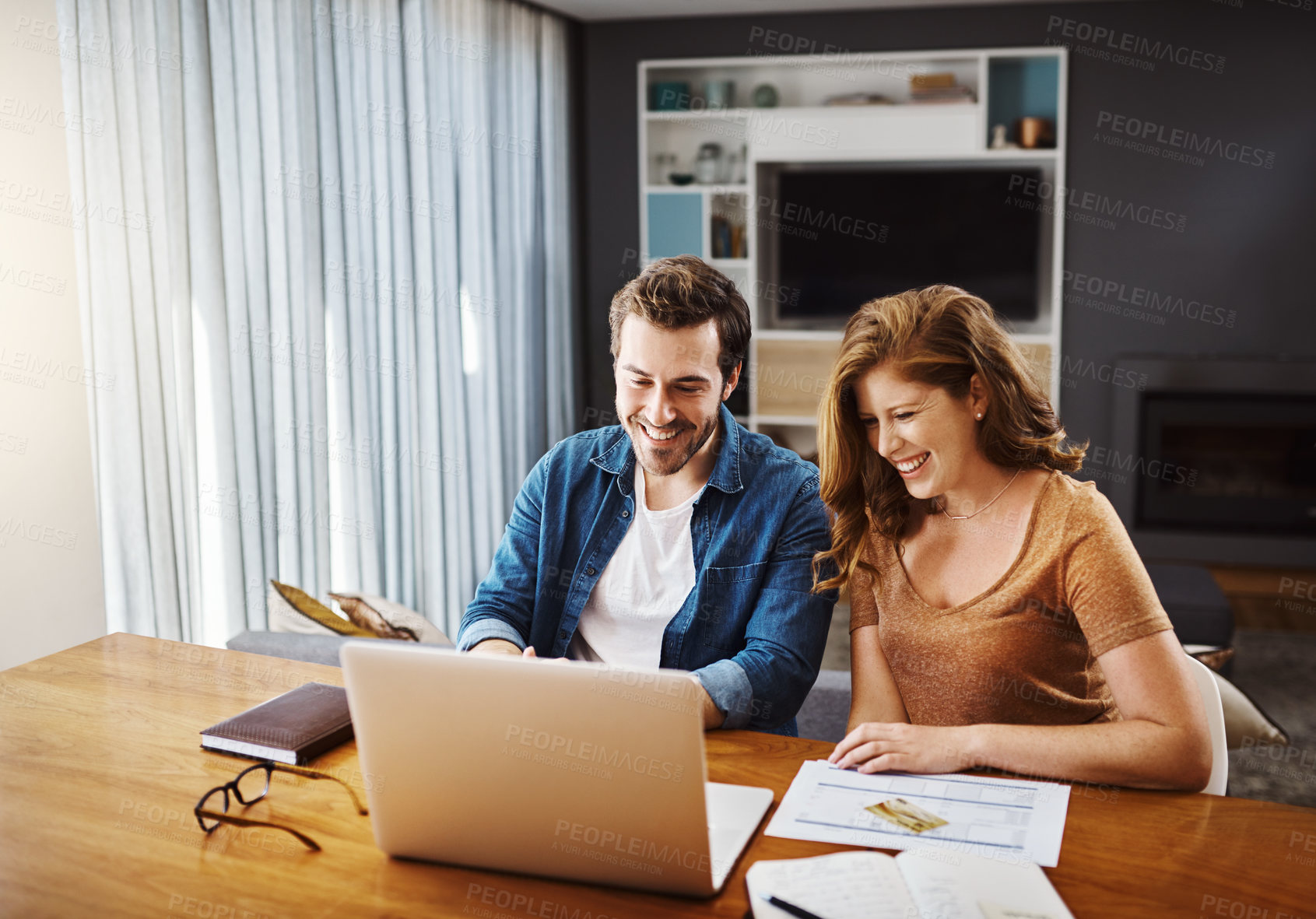 Buy stock photo Man, woman and smile with laptop in home for investment, document for mortgage or savings. Couple, house and computer with paperwork for property loan with growth, profit or planning for real estate