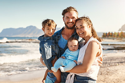 Buy stock photo Portrait of a happy family bonding at the beach