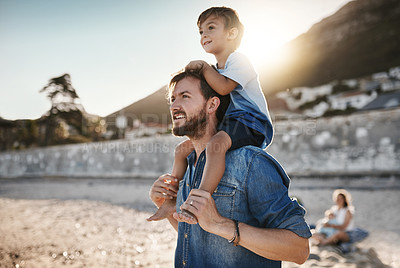 Buy stock photo Shot of a father bonding with his little son at the beach