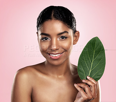Buy stock photo Portrait, face and happy woman with leaf for skincare in studio, pink background and organic dermatology. African model, leaves and eco friendly beauty, natural shine and sustainable plant cosmetics