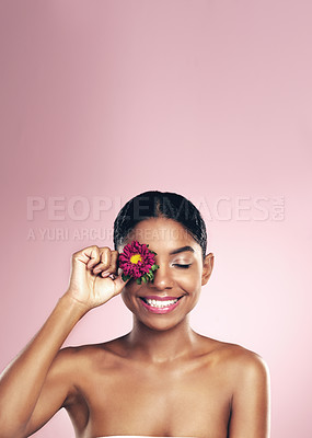 Buy stock photo Woman, flower and wellness in studio for self care with makeup on pink background for aesthetic or organic. Springtime, plant and eye with beauty, floral and blossom with clear skin with glow.