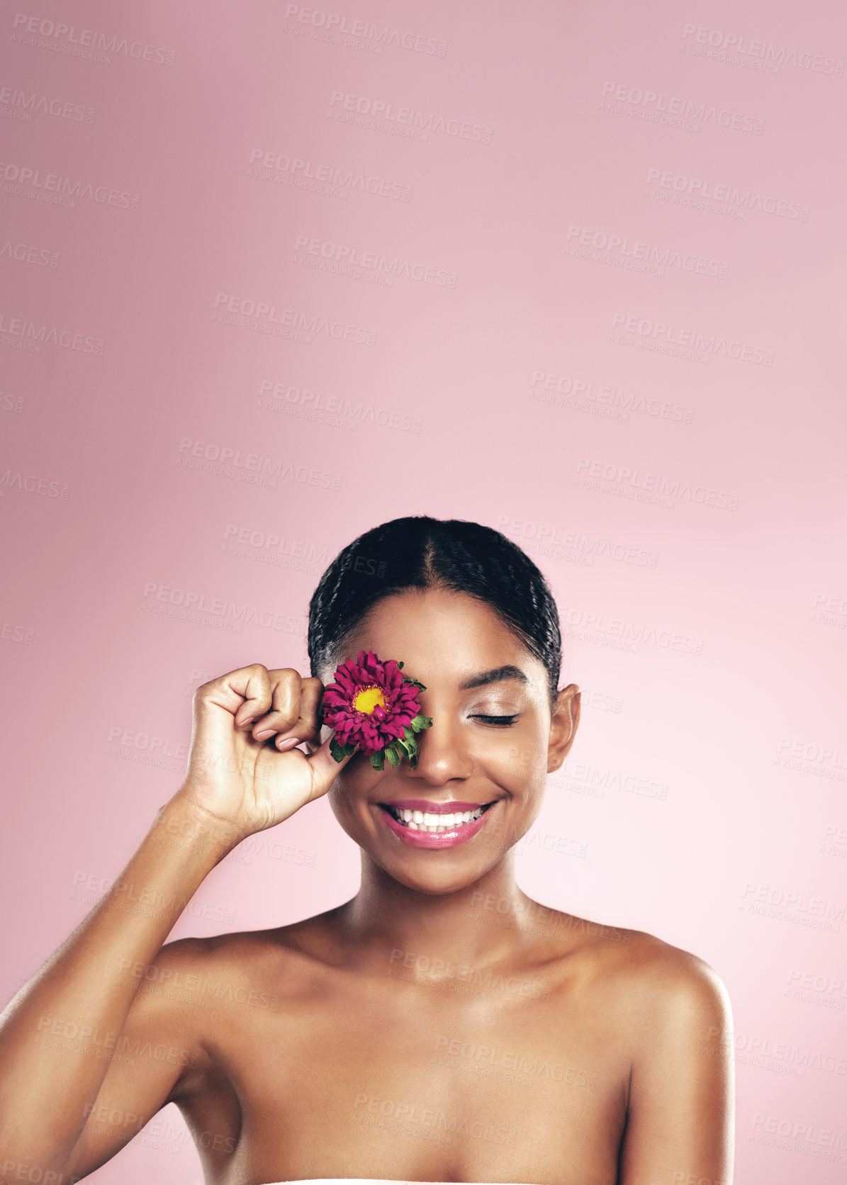 Buy stock photo Woman, flower and wellness in studio for self care with makeup on pink background for aesthetic or organic. Springtime, plant and eye with beauty, floral and blossom with clear skin with glow.