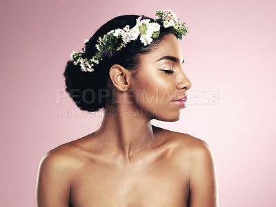 Buy stock photo Woman, flowers and hair crown for beauty in studio, pink background and natural skincare glow. African face, female model and floral headband of plants, sustainable cosmetics and eco friendly makeup 