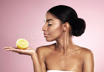 Buy stock photo Lemon fruit, beauty and woman in studio, pink background and mockup of healthy nutrition. African model, natural skincare and citrus of sustainable cosmetics, vegan dermatology and vitamin c benefits