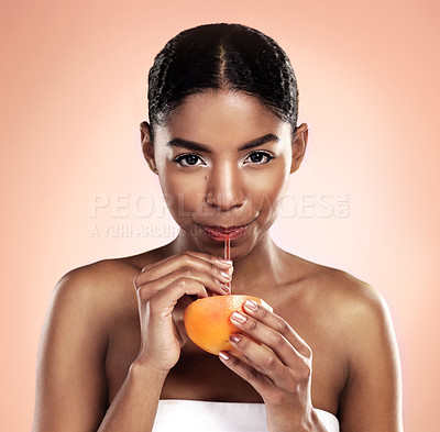 Buy stock photo Orange, juice and portrait of woman in studio for vitamin c benefits in skincare or dermatology. Citrus, drink and fruit smoothie for healthy nutrition, diet and natural beauty or organic cosmetics