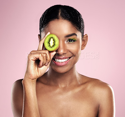 Buy stock photo Portrait, woman and kiwi for beauty in studio, pink background and healthy vitamin c cosmetics. Face of happy african model, green fruits and nutrition of natural skincare, organic benefits and glow 