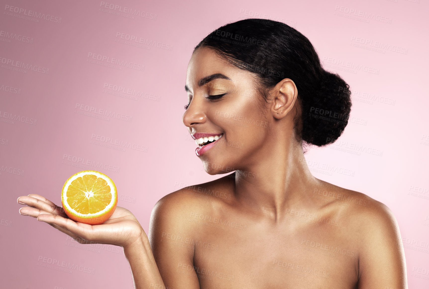 Buy stock photo Happy woman, orange fruit and beauty in studio, pink background or wellness of healthy vitamin c cosmetics. African model, citrus and nutrition for natural facial skincare, organic benefits or mockup