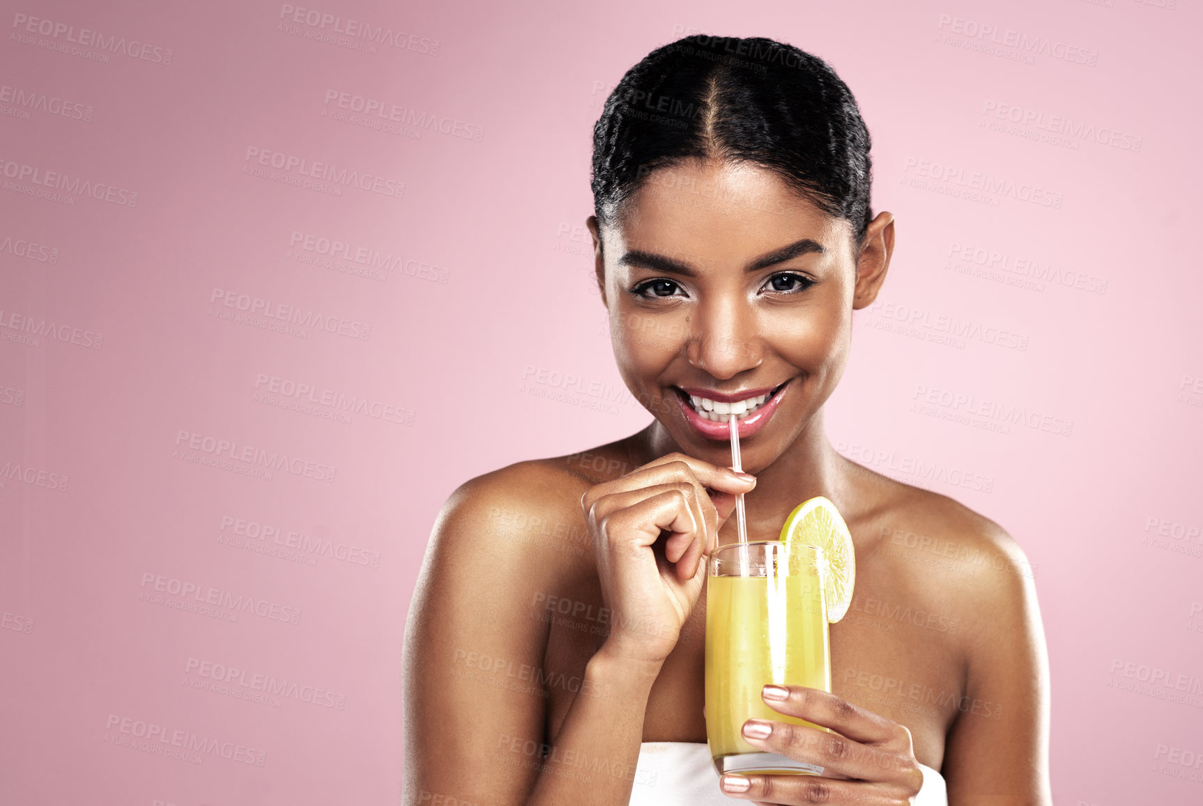 Buy stock photo Portrait, happy woman and glass of orange juice in studio for healthy nutrition, vitamin c diet or mockup on pink background. African model, fruit cocktail and citrus drink for natural skincare detox