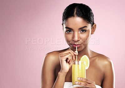 Buy stock photo Portrait of woman, glass and orange juice in studio for healthy nutrition, vitamin c or mockup on pink background. African model drinking fruit cocktail, citrus smoothie and natural diet for skincare