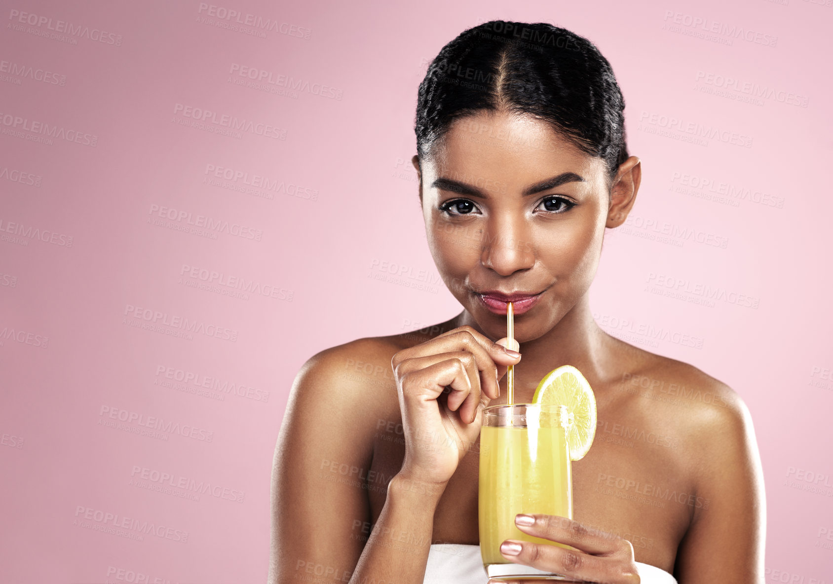 Buy stock photo Portrait of woman, glass and orange juice in studio for healthy nutrition, vitamin c or mockup on pink background. African model drinking fruit cocktail, citrus smoothie and natural diet for skincare