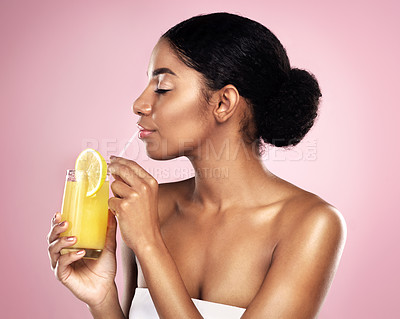 Buy stock photo Face of woman, orange juice and drink in studio, pink background and detox for healthy skincare. African model, citrus smoothie and vitamin c fruits for nutrition benefits, natural beauty or wellness