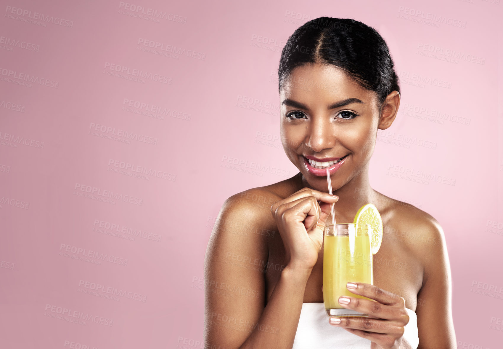Buy stock photo Portrait, happy woman and orange juice drink in studio for healthy skincare, vitamin c benefits or mockup. African model, fruit cocktail and citrus smoothie of natural beauty, diet or pink background