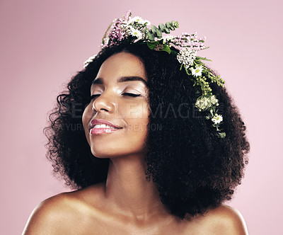 Buy stock photo Woman, face and flower crown for beauty in studio, pink background and natural glowing skincare. African, female model and floral wreath of plants, sustainable cosmetics and eco friendly dermatology 