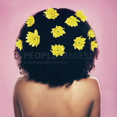 Buy stock photo Rearview shot of a woman standing with flowers in her hair