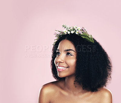 Buy stock photo Flowers, crown and woman thinking of beauty in studio, pink background and mockup of natural afro hair care. Face, happy african model and daydream with floral wreath, spring aesthetic and eco ideas