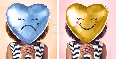 Buy stock photo Cropped shot of a young woman holding up a heart shaped balloon