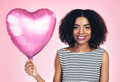 Buy stock photo Studio, portrait and girl with ballon in heart shape, celebration and smile with happiness. Female model, anniversary or valentines day gift by pink background, surprise or present for woman