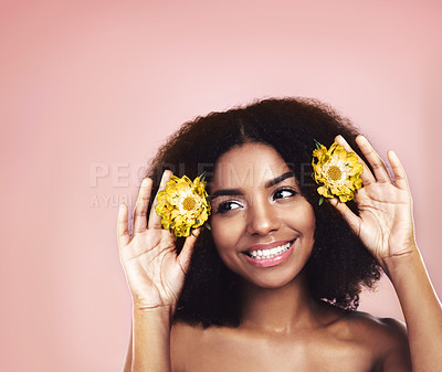 Buy stock photo Woman, studio and thinking of flowers in hair on mockup background, floral aesthetic and sustainable choice. Happy face, african model and daisy plants in afro for beauty, ideas and natural skincare