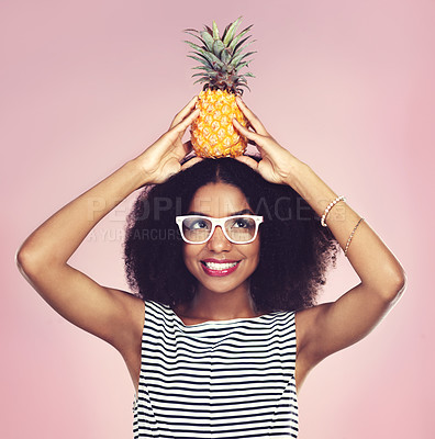 Buy stock photo Smile, black woman and pineapple with fashion, studio and happy on pink background. Food, fruit and summer clothing aesthetic for female model, natural and ethical or sustainable clothing style