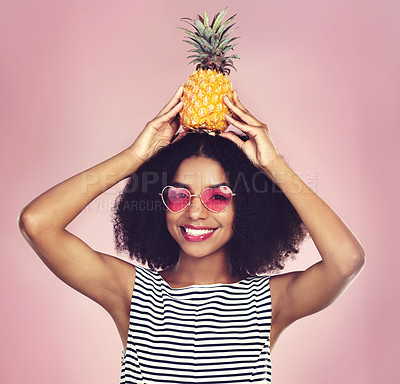 Buy stock photo Portrait, smile and woman with pineapple, glasses and fashion with confidence on pink studio background. Face, person and girl with fruit, nutrition and funky eyewear with happiness, joy and cheerful