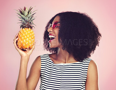 Buy stock photo Studio, profile and black woman with pineapple, detox and bite on pink background. Health, nutrition or gut digestion for weight loss and vitamins for female model, vegan diet and vitamin c for fiber