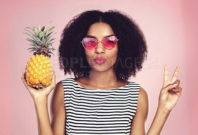 Buy stock photo Portrait, woman and pineapple with peace, studio and detox food on pink background. Nutrition, fruit and eyewear for African model, weight loss and vitamins or mineral for vegan snack and fiber