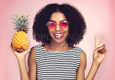 Buy stock photo Peace sign, portrait and black woman with pineapple, studio or detox on pink background. Health, nutrition and gut digestion for weight loss and vitamins for female model, vegan and vitamin for fiber