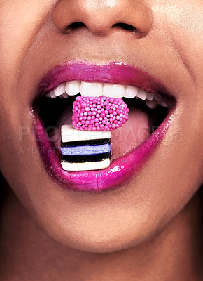 Buy stock photo Eating, closeup and black woman with sweets for nutrition, luxury and abstract isolated on pink background. Mouth, gen z girl with licorice for food, wellness and happy on studio backdrop by mockup