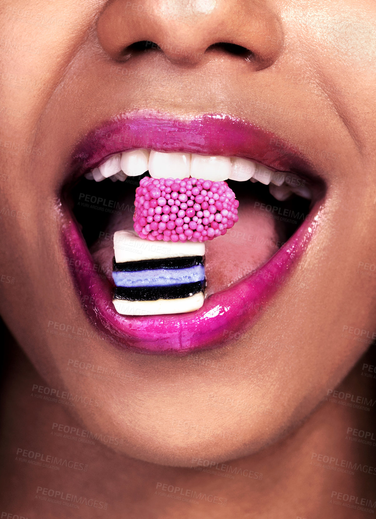 Buy stock photo Eating, closeup and black woman with sweets for nutrition, luxury and abstract isolated on pink background. Mouth, gen z girl with licorice for food, wellness and happy on studio backdrop by mockup