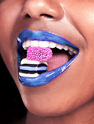 Buy stock photo Mouth, lipstick and black woman with candy for sweets, luxury and biting isolated on dark background. Eating, girl with licorice for food, wellness and happy with cosmetics on studio backdrop mockup