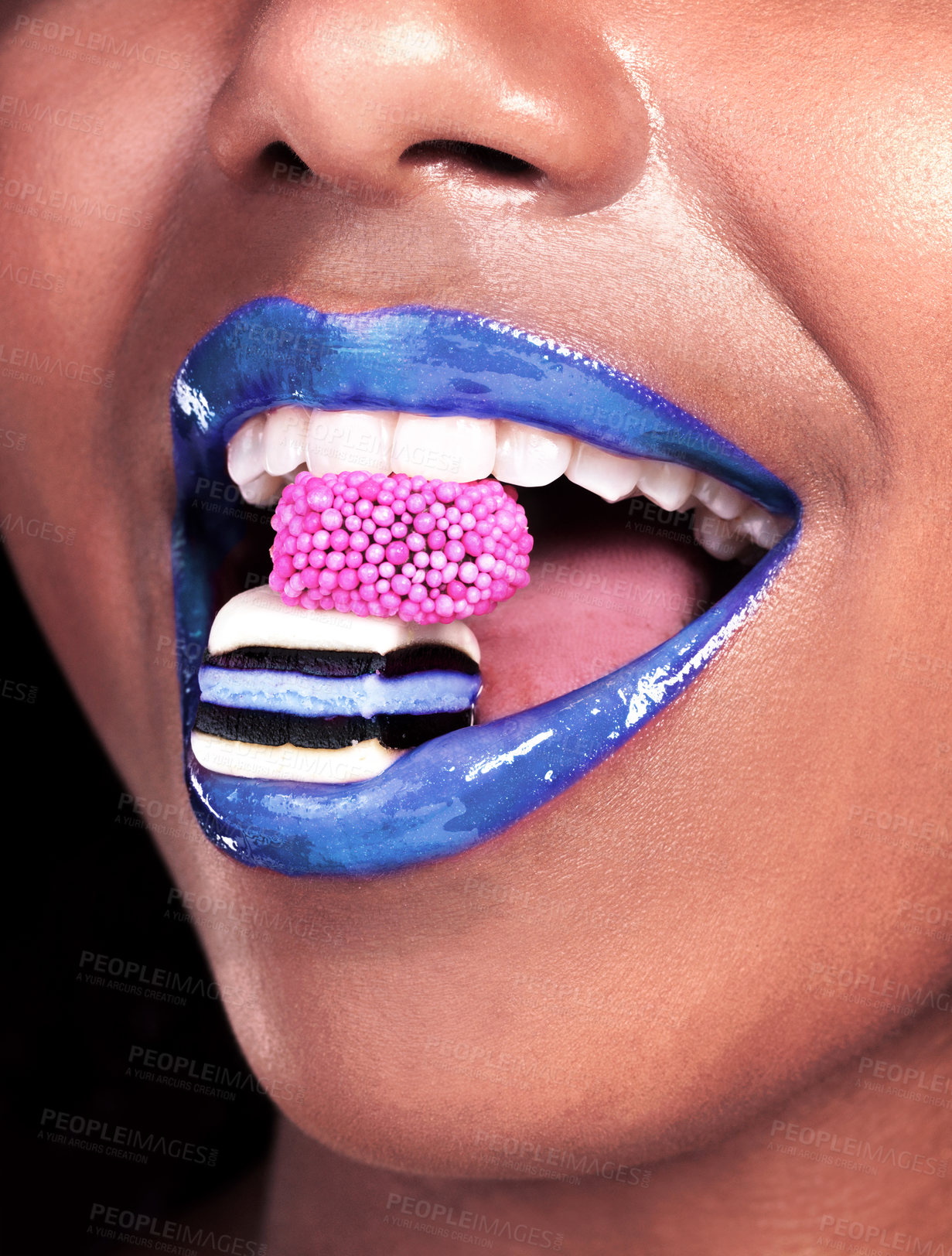 Buy stock photo Mouth, lipstick and black woman with candy for sweets, luxury and biting isolated on dark background. Eating, girl with licorice for food, wellness and happy with cosmetics on studio backdrop mockup