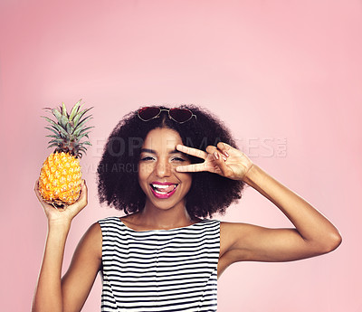 Buy stock photo Portrait, woman and pineapple with peace, studio and detox food on pink background. Nutrition, fruit and gut digestion for African model, weight loss and vitamins or mineral for vegan snack and fiber