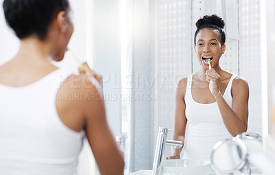 Buy stock photo Woman brushing teeth in bathroom, mirror and oral hygiene, morning routine with toothbrush and dental health. Female person at home, grooming and self care, clean mouth with toothpaste and wellness