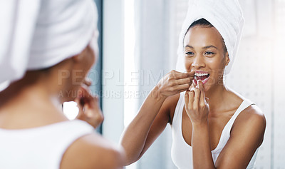 Buy stock photo Woman floss teeth in bathroom, mirror and oral hygiene, morning routine with product for dental health. Female person at home with grooming and self care, clean mouth with flossing and wellness