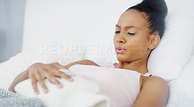 Buy stock photo Woman, stomach ache and period cramps, hot water bottle for endometriosis, health problem and sick in bed. Female person breathing through pain at home, menstruation with aid to help with hurt