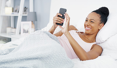 Buy stock photo Phone, laughing and woman in bed online for social media post, internet humor and funny text message. Morning, home and female person relax in bedroom on smartphone for mobile app, website and meme