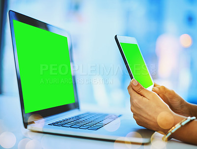 Buy stock photo Shot of an unrecognizable businesswoman using her cellphone and laptop at her office desk at work
