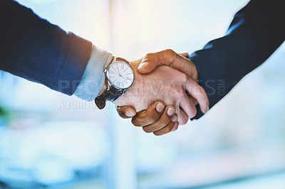 Buy stock photo Shot of two unrecognizable businessmen shaking hands at work