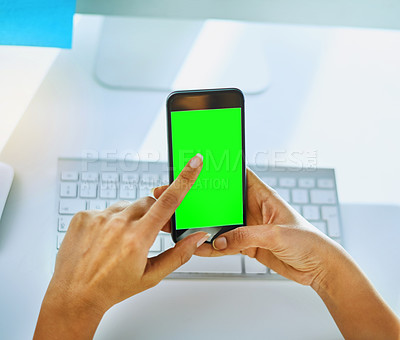 Buy stock photo Shot of an unrecognizable businesswoman using her cellphone at her office desk at work