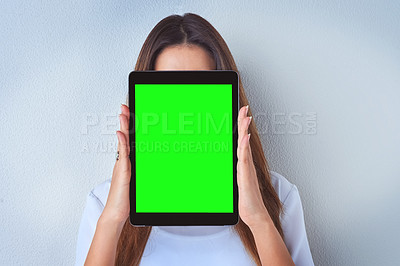 Buy stock photo Shot of an unrecognizable woman holding a digital tablet against a blue background