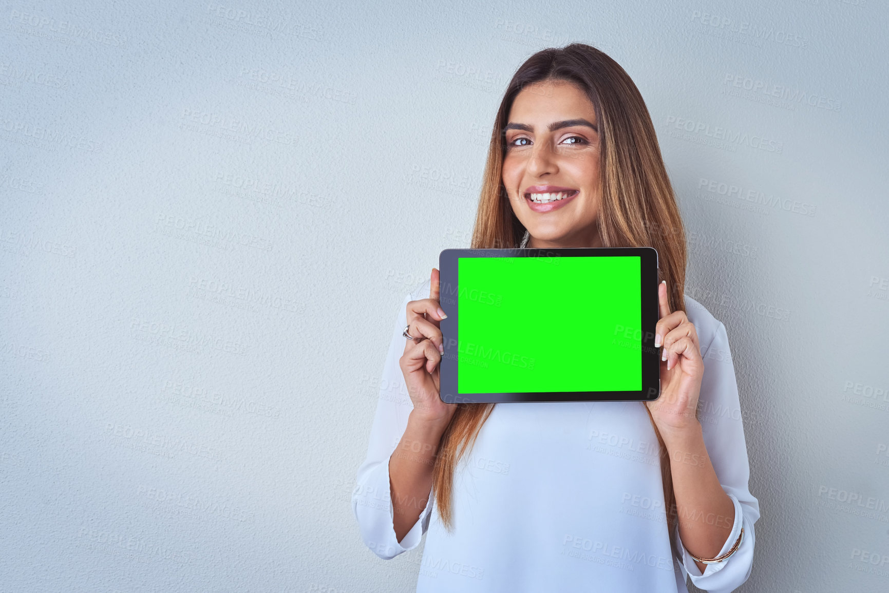 Buy stock photo Green screen, marketing and tablet with portrait of woman in studio on gray background for advertising. App, mockup space and smile of person with display for announcement, information or promotion