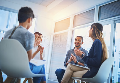 Buy stock photo Shot of a group of cheerful young businesspeople having a creative meeting at work