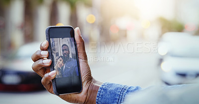 Buy stock photo Shot of a young couple taking a selfie together with a cellphone in the city