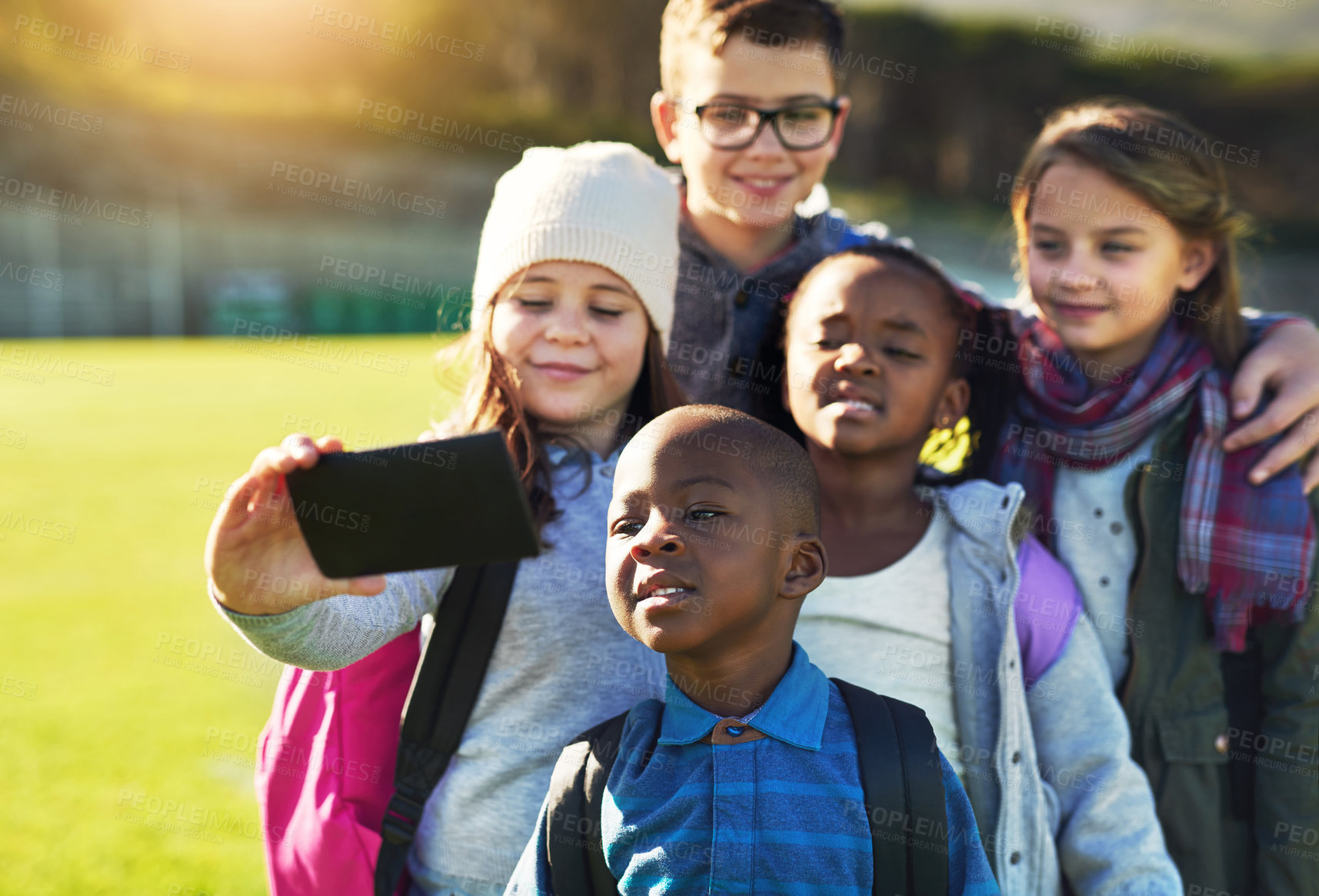 Buy stock photo Children, students and selfie at school outdoor for playground break, social media post and education. Smile, friends and kindergarten photography for profile picture update, diversity and memory